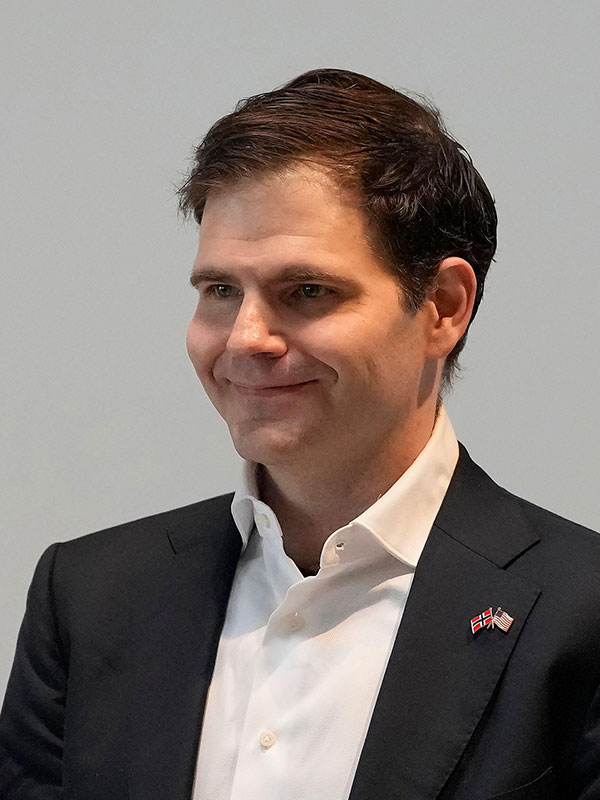Jonathan Ross, the founder of Groq, smiling in a suit