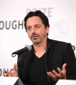 Google co-founder Sergey Brin speaking into mic