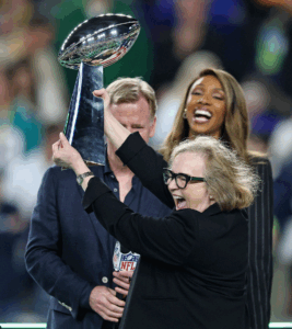 Image of Jody Allen of the Seattle Seahawks celebrating with the Vince Lombardi Trophy as NFL Commissioner Roger Goodell looks during Super Bowl LX at Levi's Stadium on February 08, 2026